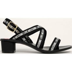 Love Moschino - Sandały. Czarne sandały damskie Love Moschino, bez wzorów, ze skóry, bez obcasa, na obcasie, na klamry. W wyprzedaży za 549,90 zł.