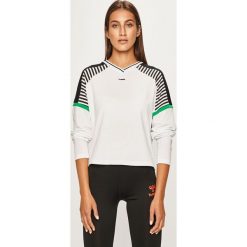 Hummel - Longsleeve. Białe bluzki damskie Hummel, s, z nadrukiem, z elastanu, casualowe, bez kołnierzyka, z krótkim rękawem. W wyprzedaży za 139,90 zł.
