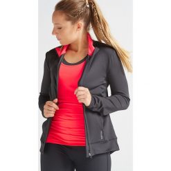 Bluza na zamek fitness kardio 100 damska. Czarne bluzy sportowe damskie DOMYOS, bez wzorów, z elastanu, bez rękawów, bez kaptura, na fitness i siłownię. Za 69,99 zł.