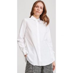Koszula oversize z bawełny organicznej - Kremowy. Białe koszule damskie Reserved, z bawełny. Za 99,99 zł.