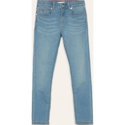 Tommy Hilfiger - Jeansy dziecięce 140-176 cm. Niebieskie jeansy dziewczęce TOMMY HILFIGER, bez wzorów, z elastanu. Za 229,90 zł.