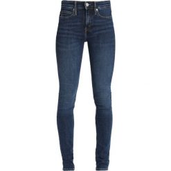 Calvin Klein Jeans CKJ 011 MID RISE SKINNY Jeans Skinny Fit amsterdam blue mid. Niebieskie jeansy damskie relaxed fit Calvin Klein Jeans, z bawełny. Za 449,00 zł.