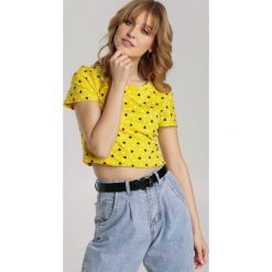 Żółty T-shirt Kleorei. Żółte bluzki damskie Renee, s, bez wzorów, z tiulu, z okrągłym kołnierzem, z krótkim rękawem. Za 39,99 zł.