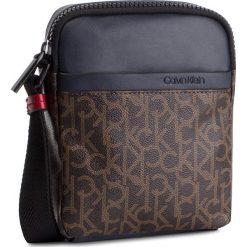 Saszetka CALVIN KLEIN - Ck Mono Mini Reporter K50K504347 908. Pomarańczowe torby męskie skórzane Calvin Klein, bez wzorów, ze skóry ekologicznej, młodzieżowe. W wyprzedaży za 239,00 zł.