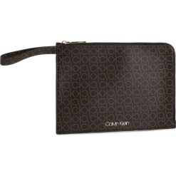 Torebka Calvin Klein Ck Must Pouch Mono K60K605895. Pomarańczowe torebki klasyczne damskie Calvin Klein, bez wzorów, wizytowe, bez dodatków. W wyprzedaży za 179,00 zł.