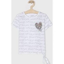 Guess Jeans - Top dziecięcy 118-175 cm. Białe bluzki dziewczęce Guess Jeans, z aplikacjami, z elastanu, z okrągłym kołnierzem, z krótkim rękawem, krótkie, bez kaptura. W wyprzedaży za 79,90 zł.