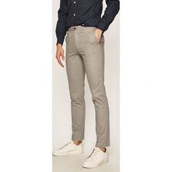 Tommy Hilfiger - Spodnie. Niebieskie spodnie męskie z elastanu, casualowe. Za 539,90 zł.
