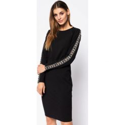 Sukienka dzianinowa DKNY Sport DP9D4189. Czarne sukienki damskie DKNY Sport, m, bez wzorów, z elastanu, sportowe, bez kołnierzyka, bez rękawów, sportowe. W wyprzedaży za 279,00 zł.