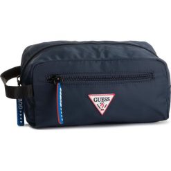 Kosmetyczka GUESS - Smart HM6737 POL93 NAV. Niebieskie kosmetyczki męskie Guess, z aplikacjami, z tkaniny. W wyprzedaży za 149,00 zł.
