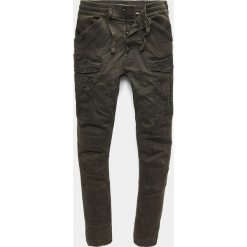 Bojówki "Rovic" w kolorze khaki. Brązowe spodnie męskie G-Star, m, bez wzorów. W wyprzedaży za 345,95 zł.