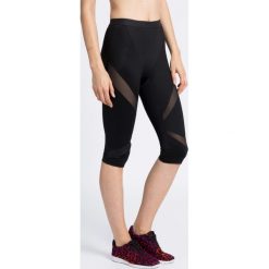 Triumph - Legginsy Triaction The Fit-ster Capri. Czarne legginsy marki Triumph, s, z elastanu. W wyprzedaży za 139,90 zł.