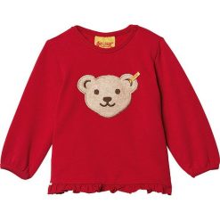 Bluza w kolorze czerwonym. Czerwone bluzy niemowlęce Steiff, z aplikacjami, bez rękawów, bez kaptura. W wyprzedaży za 45,95 zł.