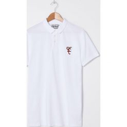 Koszulka polo Looney Tunes - Biały. Białe koszulki polo męskie House, s, bez wzorów, bez rękawów. Za 49,99 zł.