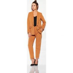 Spodnie basic L316B karmel brązowy. Pomarańczowe spodnie damskie Tagless, s, z materiału. Za 109,90 zł.