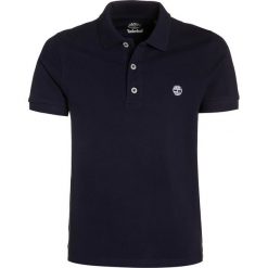 Timberland Koszulka polo blue indigo. Niebieskie t-shirty chłopięce polo marki Timberland, z bawełny. Za 149,00 zł.