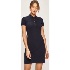 Lacoste - Sukienka. Niebieskie sukienki damskie Lacoste, na co dzień, s, bez wzorów, z elastanu, casualowe, bez kołnierzyka, z krótkim rękawem, krótkie, mini, proste. W wyprzedaży za 399,90 zł.