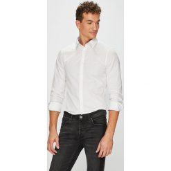 Guess Jeans - Koszula Sunset. Białe koszule męskie marki Guess Jeans, xl, z aplikacjami, z bawełny, eleganckie, z klasycznym kołnierzykiem, z długim rękawem. W wyprzedaży za 199,90 zł.