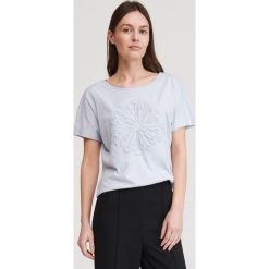 T-shirt ze strukturalnym wzorem - Niebieski. Niebieskie t-shirty damskie Reserved, xl, bez wzorów, bez kołnierzyka. W wyprzedaży za 19,99 zł.