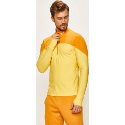 Under Armour - Bluza. Żółte bluzy męskie Under Armour, s, bez wzorów, z dzianiny, z kapturem, z krótkim rękawem, krótkie, bez kaptura. W wyprzedaży za 199,90 zł.