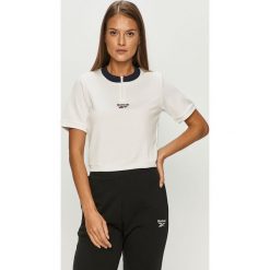 Reebok Classic - T-shirt. Białe topy damskie Reebok Classic, s, z aplikacjami, z elastanu, casualowe, z okrągłym kołnierzem. Za 99,90 zł.