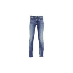 Jeansy slim fit Tommy Jeans SCANTON. Niebieskie jeansy męskie relaxed fit marki Tommy Jeans, l, z nadrukiem, z bawełny, bez kaptura. Za 447,20 zł.