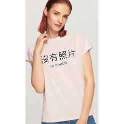 T-shirt z nadrukiem - Fioletowy. Fioletowe t-shirty damskie marki DOMYOS, l, z bawełny. Za 29,99 zł.