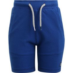 Tumble 'n dry LUCO Spodnie treningowe college blue. Niebieskie spodnie chłopięce marki Tumble 'n dry, z bawełny. Za 129,00 zł.