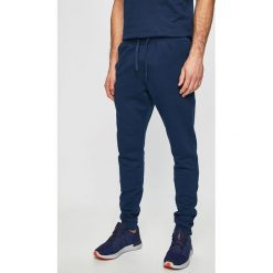 Under Armour - Spodnie. Niebieskie spodnie męskie Under Armour, s, bez wzorów, z bawełny. Za 189,90 zł.