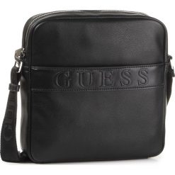 Saszetka GUESS - Dan HM6838 PL201 BLA. Czarne torby męskie skórzane Guess, z aplikacjami, ze skóry ekologicznej, młodzieżowe. W wyprzedaży za 299,00 zł.