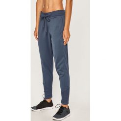 Under Armour - Spodnie. Niebieskie spodnie damskie Under Armour, s, bez wzorów, z poliesteru. Za 229,90 zł.