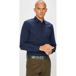 Tommy Jeans - Koszula. Niebieskie koszule męskie marki Tommy Jeans, m, z elastanu, klasyczne, z klasycznym kołnierzykiem, z długim rękawem. Za 269,90 zł.