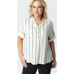 Kremowa Bluzka Tanianos. Brązowe bluzki damskie Born2be, xl, bez wzorów, z jeansu, ze stójką, plus size, bez rękawów. Za 69,99 zł.