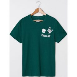 Koszulka Looney Tunes - Khaki. Brązowe koszulki męskie House, s, bez wzorów, bez kołnierzyka, bez rękawów. Za 49,99 zł.