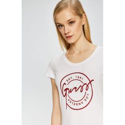Guess Jeans - Top. Białe bluzki damskie marki Guess Jeans, s, z nadrukiem, z bawełny, casualowe, z okrągłym kołnierzem, z krótkim rękawem. W wyprzedaży za 149,90 zł.