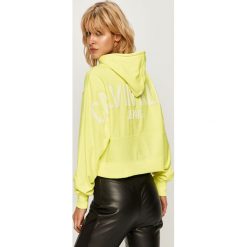 Calvin Klein Jeans - Bluza. Żółte bluzy damskie Calvin Klein Jeans, s, z aplikacjami, z elastanu, bez rękawów, z kapturem. Za 449,90 zł.