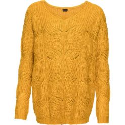 Sweter dzianinowy z dekoltem w serek bonprix żółty szafranowy. Żółte swetry damskie bonprix, bez wzorów, z dzianiny, bez rękawów, bez kaptura. Za 89,99 zł.