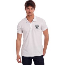 Koszulka polo w kolorze białym. Białe topy sportowe damskie Polo Club, s, z haftami, z bawełny, z krótkim rękawem. W wyprzedaży za 84,95 zł.