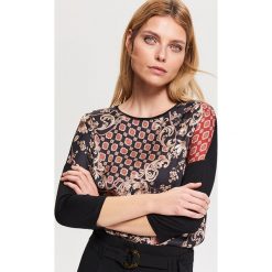 Wzorzysta bluzka z wiskozy - Czarny. Czarne bluzki damskie Reserved, bez wzorów, z wiskozy, bez kołnierzyka, bez rękawów. Za 59,99 zł.