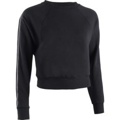 Bluza crop do tańca miejskiego damska czarna. Czarne bluzy damskie DOMYOS, bez wzorów, z elastanu, z krótkim rękawem, krótkie, bez kaptura. Za 99,99 zł.