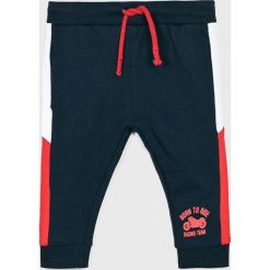 Blukids - Spodnie dziecięce 68 - 98 cm. Niebieskie spodnie chłopięce Blukids, bez wzorów, z bawełny, casualowe. Za 49,90 zł.