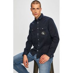Calvin Klein Jeans - Koszula. Niebieskie koszule męskie Calvin Klein Jeans, s, bez wzorów, z bawełny, klasyczne, z klasycznym kołnierzykiem, z długim rękawem. W wyprzedaży za 299,90 zł.