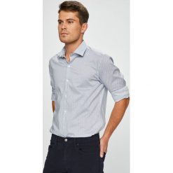 Pierre Cardin - Koszula. Niebieskie koszule męskie marki Pierre Cardin, s, bez wzorów, z elastanu, eleganckie, z włoskim kołnierzykiem, z długim rękawem. W wyprzedaży za 179,90 zł.