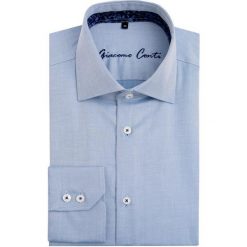 Koszula UGO slim KMN00020. Niebieskie koszule męskie na spinki Giacomo Conti, m, z bawełny, z klasycznym kołnierzykiem. Za 229,00 zł.