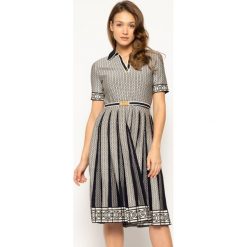 Sukienka koktajlowa Tory Burch Gemini Link 63191. Sukienki damskie Tory Burch, na co dzień, s, bez wzorów, z elastanu, bez kołnierzyka, bez rękawów, proste. W wyprzedaży za 1579,00 zł.