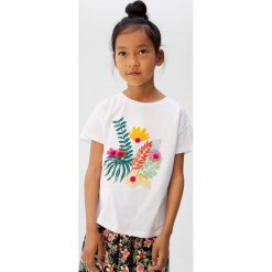 Mango Kids - Top dziecięcy Plantas 110-152 cm. Białe bluzki dziewczęce Mango Kids, z nadrukiem, z bawełny, z okrągłym kołnierzem, z krótkim rękawem, krótkie, bez kaptura. W wyprzedaży za 29,90 zł.
