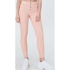 Spodnie skinny - Pomarańczowy. Pomarańczowe spodnie damskie Sinsay, bez wzorów. Za 59,99 zł.
