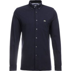 Lacoste Koszula navy blue. Niebieskie koszule męskie Lacoste, m, bez wzorów, z bawełny, bez kołnierzyka, bez rękawów. Za 509,00 zł.
