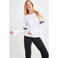 BLUZA EA7 EMPORIO ARMANI. Bluzy damskie EA7 Emporio Armani, xxl, bez wzorów, bez rękawów, bez kaptura. Za 499,00 zł.
