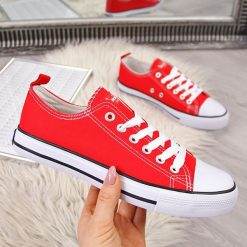 Tenisówki tekstylne czerwone American Club - czerwony. Czerwone trampki i tenisówki damskie American CLUB, bez wzorów, bez zapięcia. Za 49,99 zł.