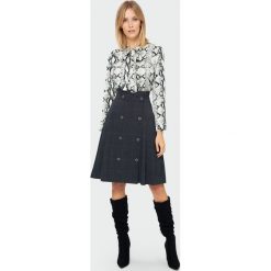 Spódnica rozkloszowana w kratę - 42. Spódniczki damskie e-margeritka.pl, na zimę, bez wzorów, z poliesteru, eleganckie, z podwyższonym stanem, rozkloszowane. Za 69,99 zł.
